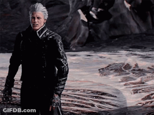 A Man With Gray Hair And A Black Jacket Stands In Front Of A Body Of Water GIF