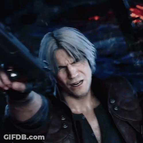 A Man With Gray Hair Is Holding A Gun In His Hand GIF