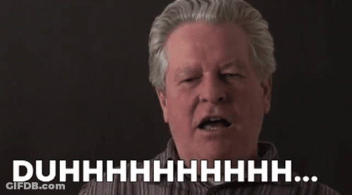 A Man With Gray Hair Is Making A Funny Face With His Eyes Closed And The Words Duhhhh . GIF