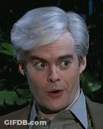 A Man With Gray Hair Is Making A Funny Face . GIF