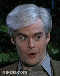 A Man With Gray Hair Is Making A Surprised Face . GIF