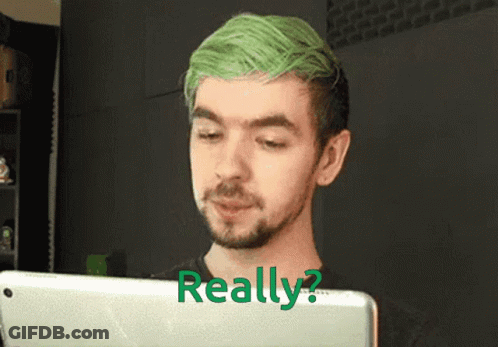 A Man With Green Hair And A Beard Is Looking At A Tablet With The Words Really Written On It GIF