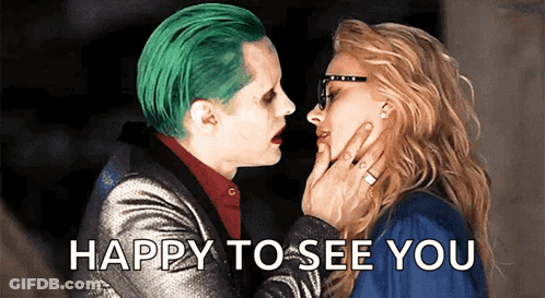 A Man With Green Hair Is Kissing A Woman With The Words Happy To See You Written Below Them GIF