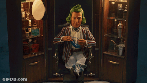 A Man With Green Hair Is Sitting In A Chair With The Words " Goodnight Sir " Below Him GIF