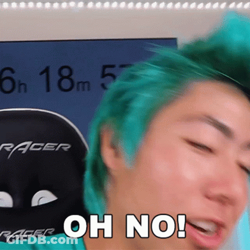 A Man With Green Hair Is Sitting In A Racer Chair GIF