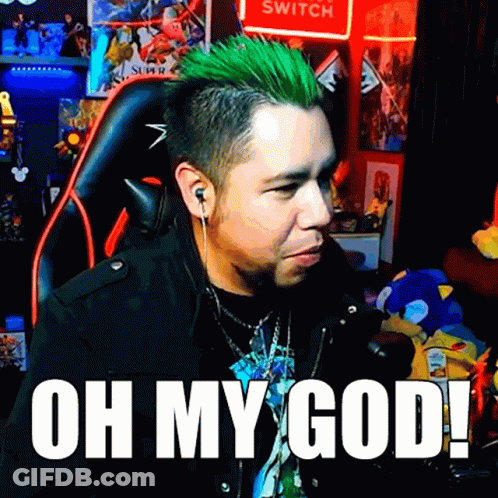 A Man With Green Hair Is Sitting In Front Of A Sign That Says Switch GIF