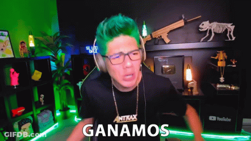 A Man With Green Hair Is Wearing Headphones And A Shirt That Says Antax On It GIF