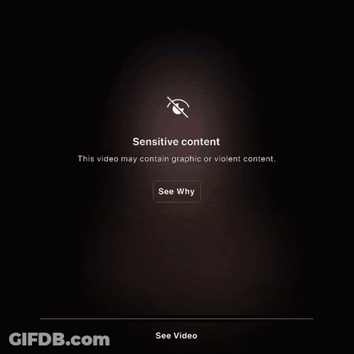 A Man With Headphones And A Cane Standing Next To A Barrel That Says Sensitive Content On It GIF