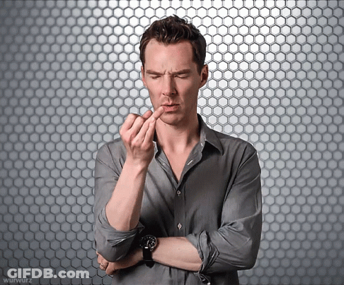 A Man With His Arms Crossed And A Watch On His Wrist GIF