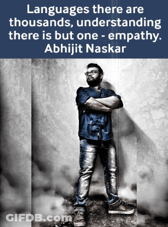 A Man With His Arms Crossed Is Standing In Front Of A Wall With A Quote From Abhijit Naskar GIF