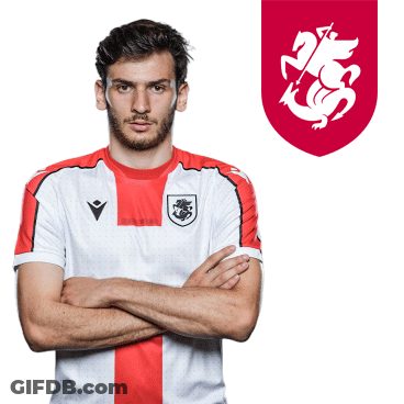 A Man With His Arms Crossed Is Wearing A White And Red Jersey GIF