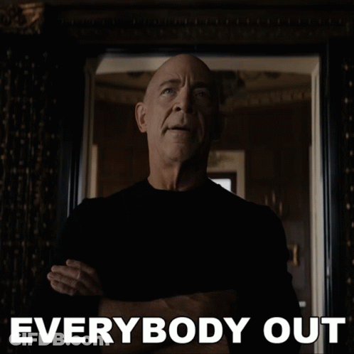 A Man With His Arms Crossed Stands In Front Of A Mirror With The Words " Everybody Out " Below Him GIF