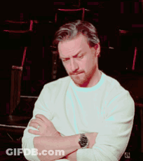 A Man With His Arms Crossed Wearing A Watch And A White Shirt GIF