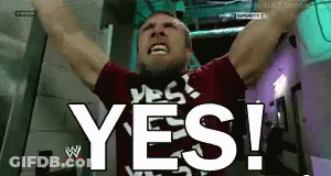 A Man With His Arms In The Air And The Word Yes Behind Him GIF