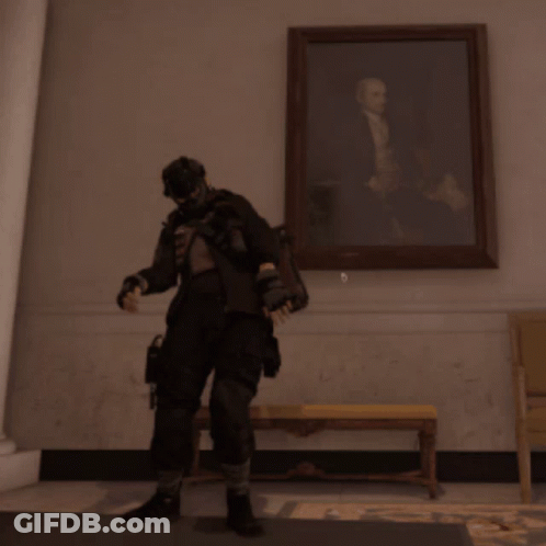 A Man With His Arms In The Air In Front Of A Picture GIF