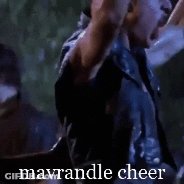 A Man With His Arms In The Air With The Words Mavrandle Cheer Written Below Him GIF