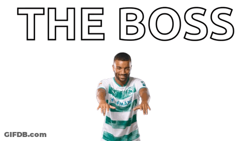 A Man With His Arms In The Air With The Words " The Boss " Written Above Him GIF