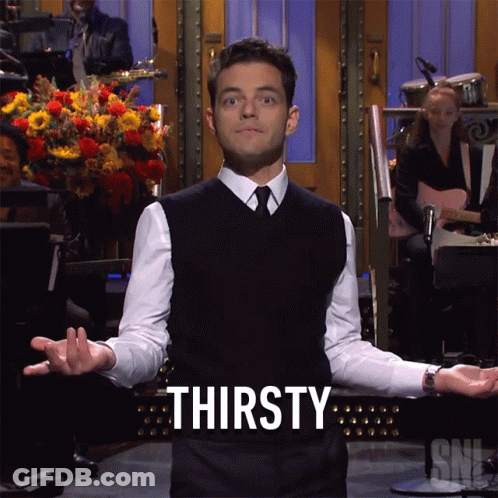 A Man With His Arms Outstretched And The Word Thirsty Behind Him GIF