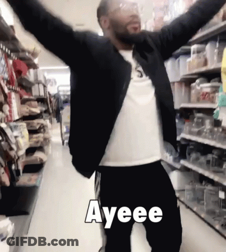 A Man With His Arms Outstretched In A Store With Ayeee Written In White Letters GIF