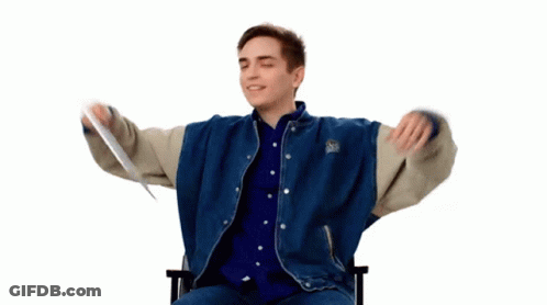 A Man With His Arms Outstretched Is Wearing A Blue And White Jacket With The Word Boston On The Sleeves GIF
