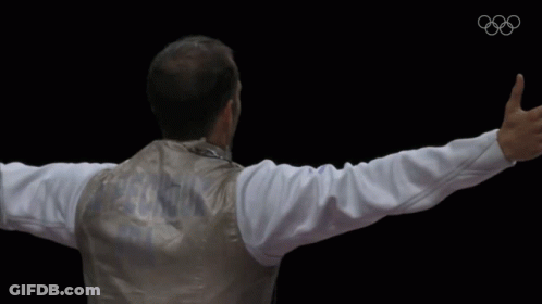 A Man With His Arms Outstretched Is Wearing A Jacket With The Word Argentina On It GIF