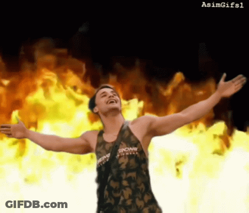 A Man With His Arms Outstretched Is Wearing A Tank Top That Says Strong On It GIF