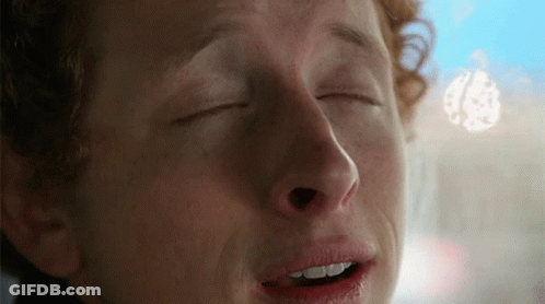 A Man With His Eyes Closed And His Mouth Open GIF