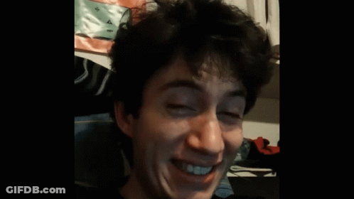 A Man With His Eyes Closed And His Mouth Open GIF