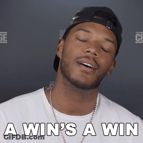 A Man With His Eyes Closed And The Words A Win 'S A Win GIF