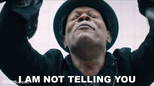 A Man With His Eyes Closed And The Words " I Am Not Telling You " Above Him GIF