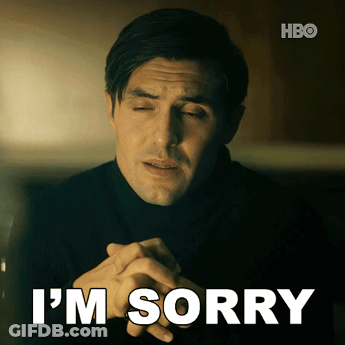 A Man With His Eyes Closed And The Words I 'M Sorry Below Him GIF
