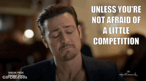 A Man With His Eyes Closed And The Words " Unless You 'Re Not Afraid Of A Little Competition " Above Him GIF