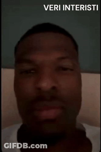 A Man With His Eyes Closed And The Words Veri Interisti On The Bottom Right GIF