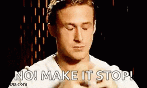 A Man With His Eyes Closed Is Holding A Kitten And Says `` No ! Make It Stop ! '' GIF