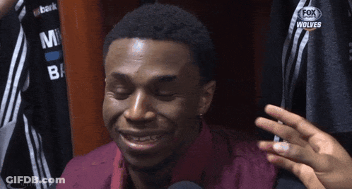 A Man With His Eyes Closed Is Wearing A Fox Sports Jersey GIF