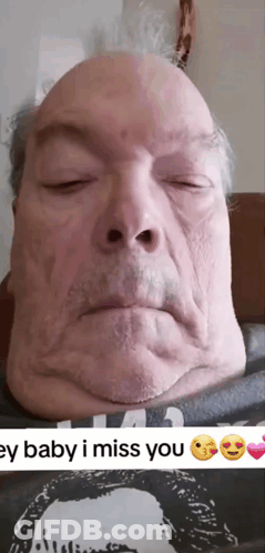 A Man With His Eyes Closed Is Wearing A Shirt That Says ' I Miss You ' On It GIF