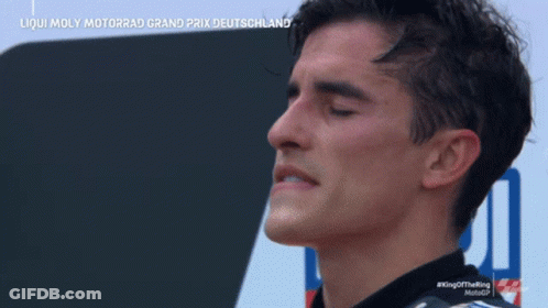 A Man With His Eyes Closed Is Wearing An Alpinestars Jacket GIF