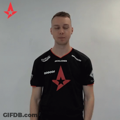 A Man With His Eyes Closed Wears A Black Shirt With A Jack & Jones Logo On It GIF