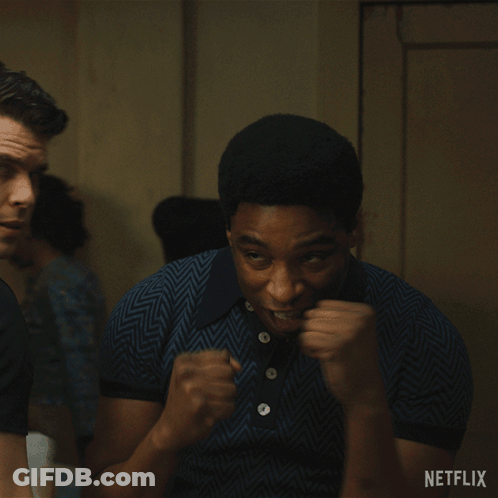 A Man With His Fist In The Air And A Netflix Logo In The Corner GIF