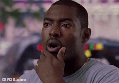 A Man With His Hand On His Chin And His Mouth Open GIF