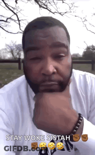 A Man With His Hand On His Chin And The Words Stay Woke Sitah GIF