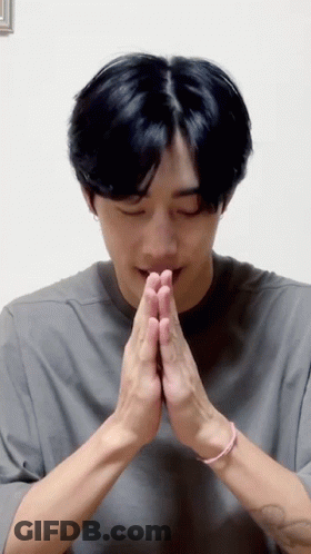 A Man With His Hands Folded In Prayer . GIF