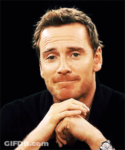 A Man With His Hands Folded Making A Face GIF