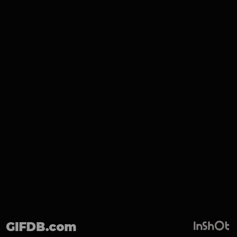 A Man With His Hands In His Pockets Stands In Front Of A Large House GIF