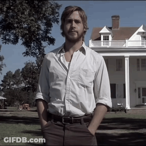 A Man With His Hands In His Pockets Stands In Front Of A Large White House GIF