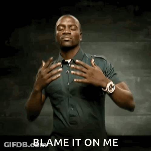 A Man With His Hands On His Chest And The Words Blame It On Me Behind Him GIF