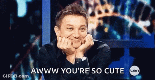 A Man With His Hands On His Face And The Words Awww You 'Re So Cute GIF