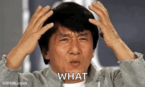 A Man With His Hands On His Head Is Making A Funny Face . GIF
