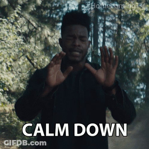 A Man With His Hands Up And The Word Calm Down Below Him GIF