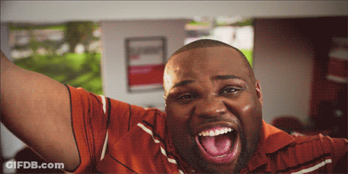 A Man With His Mouth Open And His Arms In The Air GIF